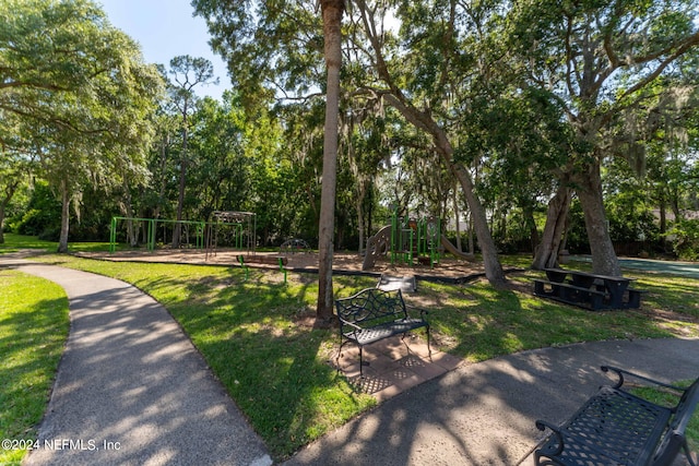 view of community featuring a lawn and playground community