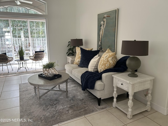 living area featuring baseboards and tile patterned floors