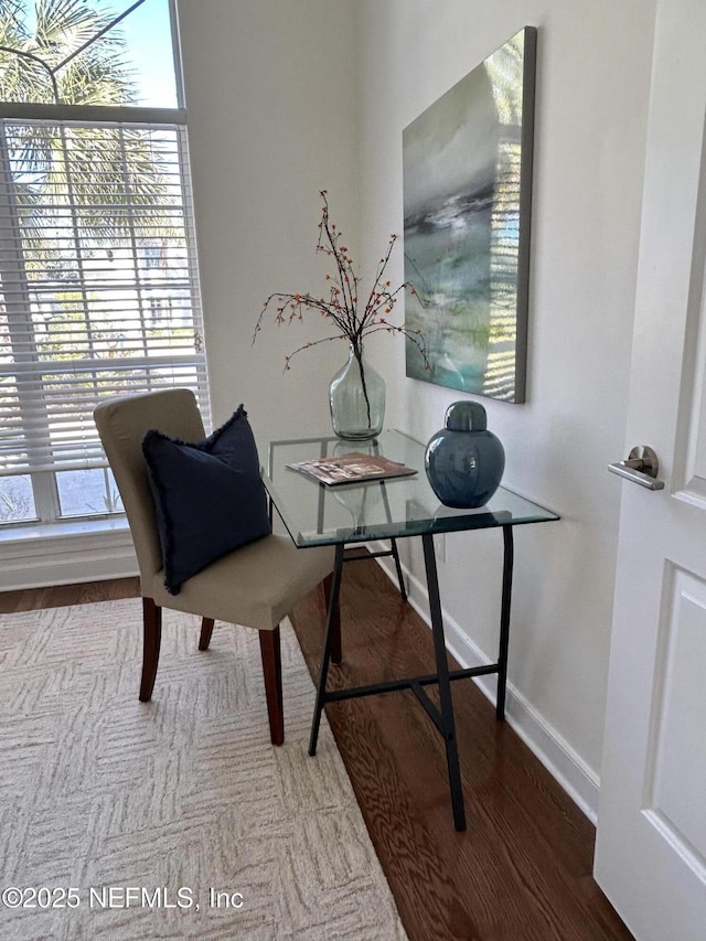 home office featuring wood finished floors and baseboards