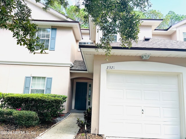 view of front of property with a garage