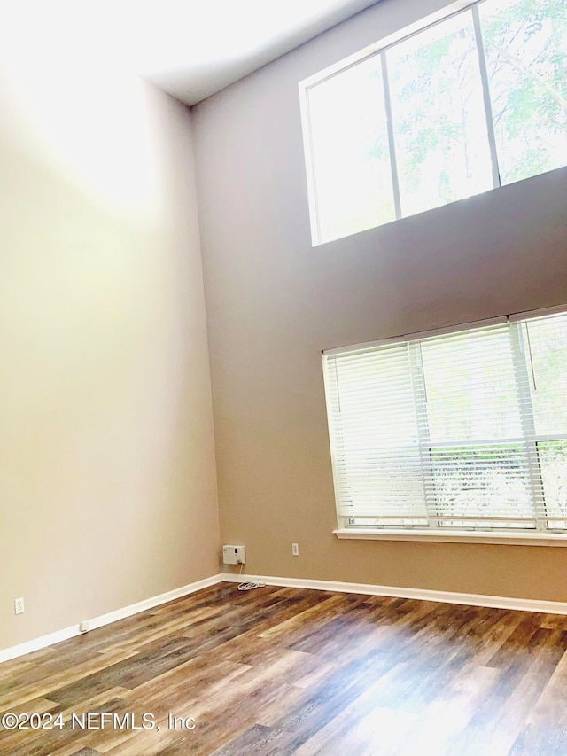 unfurnished room featuring hardwood / wood-style flooring