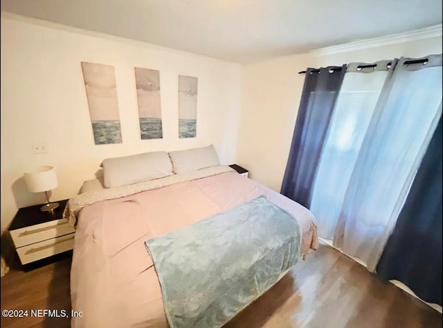 bedroom featuring dark hardwood / wood-style flooring