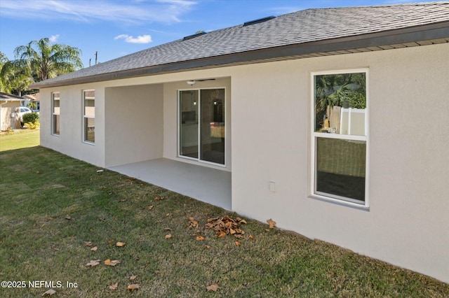 back of house featuring a yard and a patio