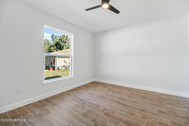 empty room featuring light hardwood / wood-style flooring, plenty of natural light, and ceiling fan