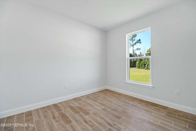 spare room featuring light hardwood / wood-style floors