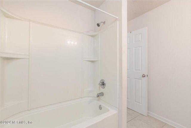 bathroom with bathtub / shower combination and tile patterned floors