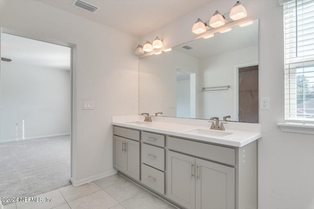 bathroom featuring tile patterned floors and vanity