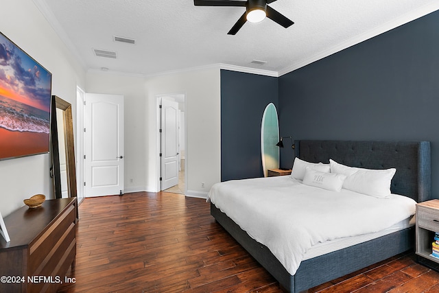 bedroom with a textured ceiling, dark hardwood / wood-style flooring, ceiling fan, and ornamental molding