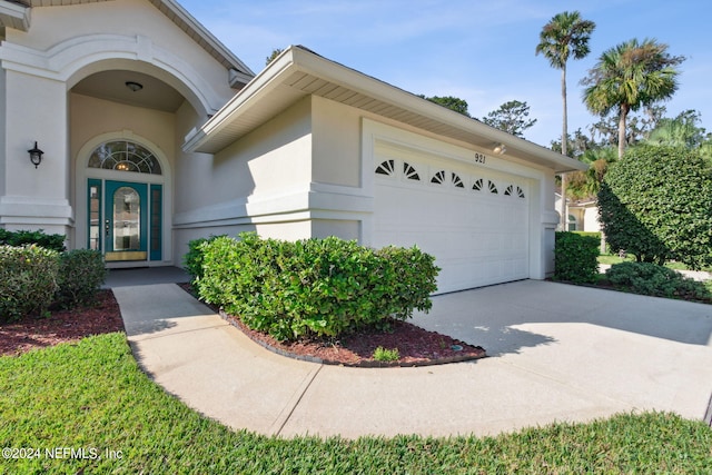 doorway to property featuring a garage