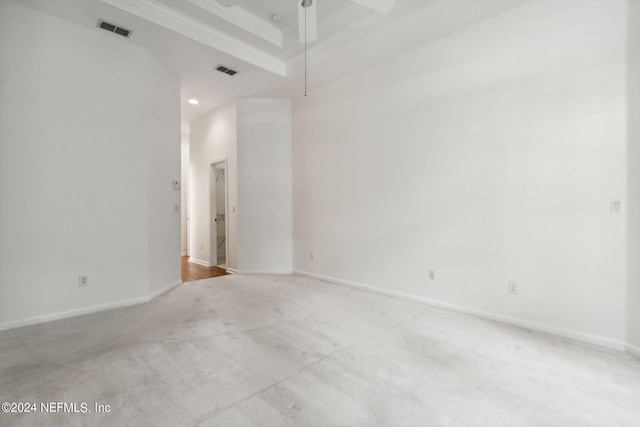 unfurnished room with light carpet, crown molding, and ceiling fan