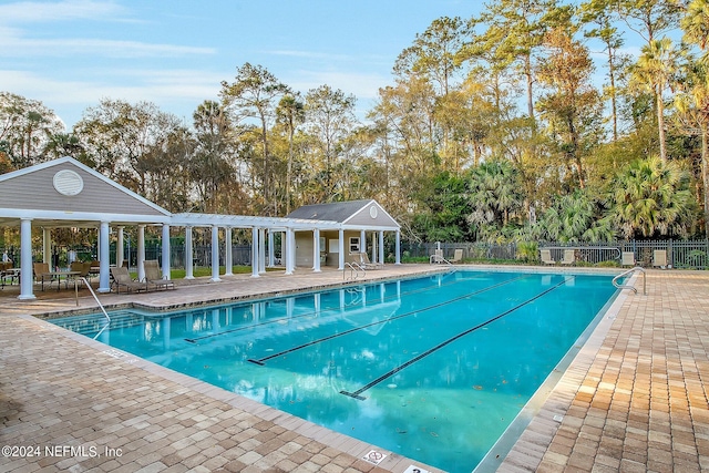 view of swimming pool featuring a patio