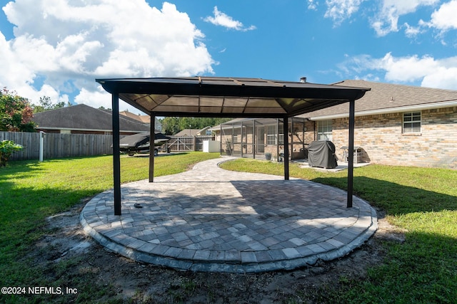 view of patio featuring a gazebo and a grill