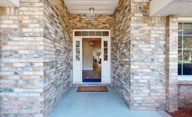 entrance to property with brick siding