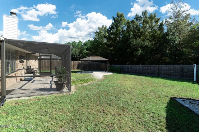 view of yard featuring a gazebo and a patio area