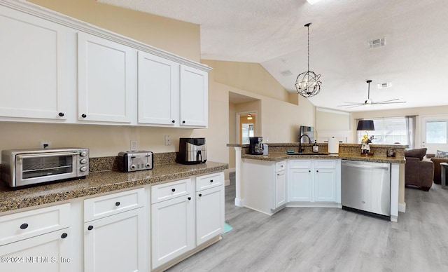 kitchen with stainless steel dishwasher, light wood-style flooring, open floor plan, ceiling fan, and white cabinetry