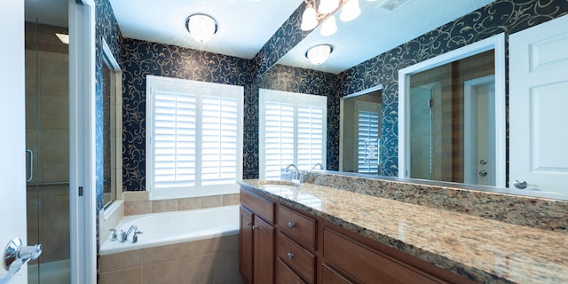 bathroom with vanity and plus walk in shower