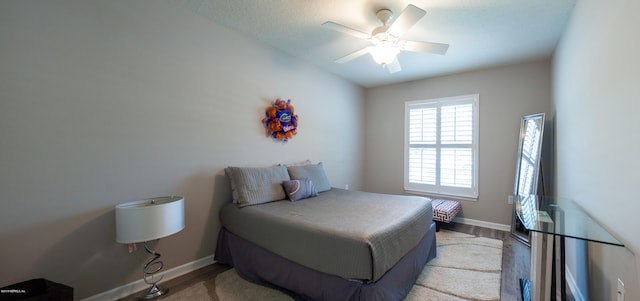 bedroom featuring light wood-type flooring and ceiling fan