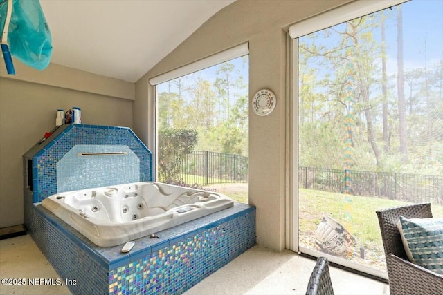 sunroom / solarium with a hot tub