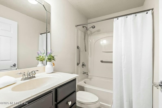 full bath featuring shower / bath combo with shower curtain, toilet, a textured ceiling, and vanity