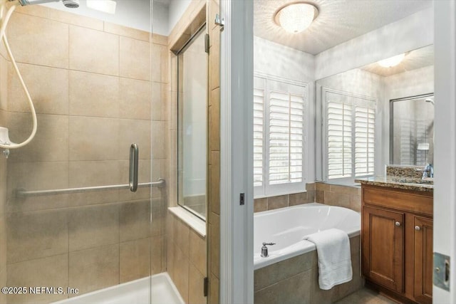 full bath featuring vanity, a shower stall, and a bath