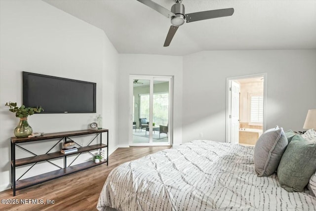 bedroom featuring access to outside, wood finished floors, baseboards, and vaulted ceiling