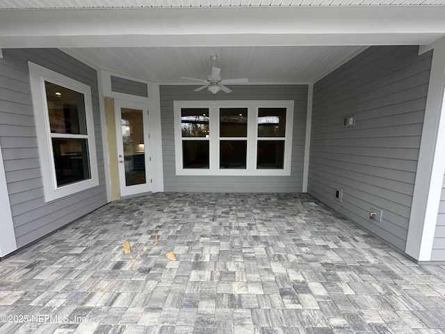 view of patio featuring ceiling fan