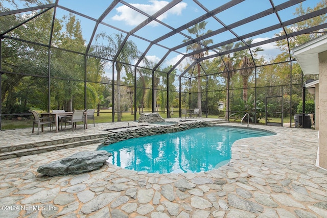 view of pool featuring a patio area and a lanai