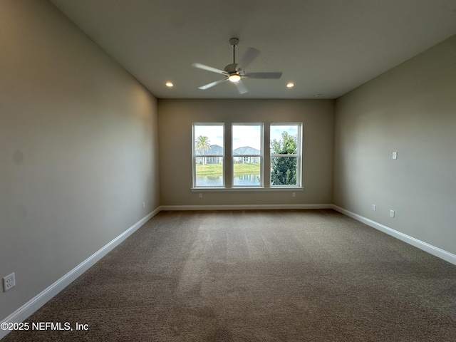 unfurnished room featuring carpet floors, recessed lighting, and baseboards