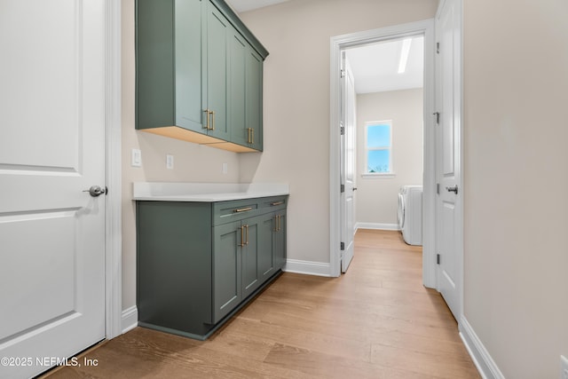 335 Lamego Ln, Saint Augustine, FL 32095 - interior space featuring light wood finished floors, baseboards, and washer / dryer