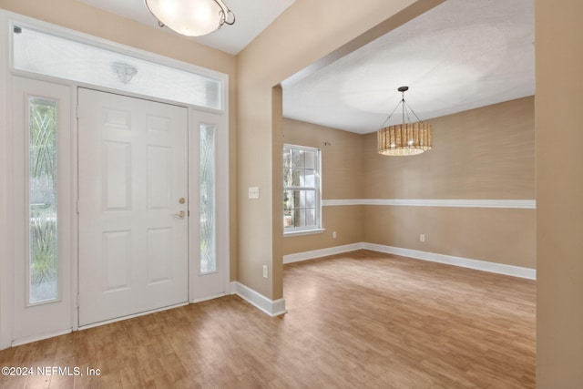 entryway with hardwood / wood-style flooring and plenty of natural light