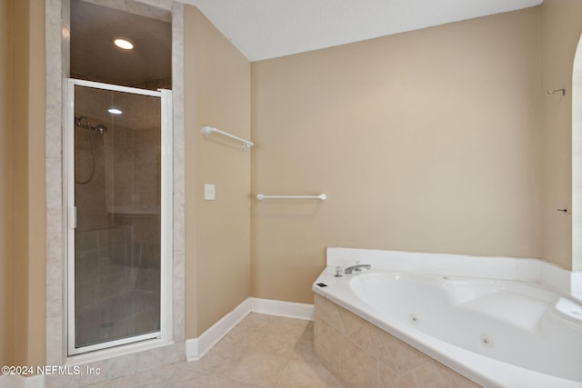 bathroom with shower with separate bathtub and tile patterned flooring