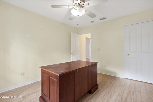 home office featuring ceiling fan and light wood-type flooring