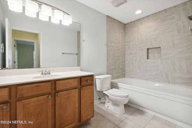 full bathroom featuring vanity, washtub / shower combination, tile patterned flooring, and toilet