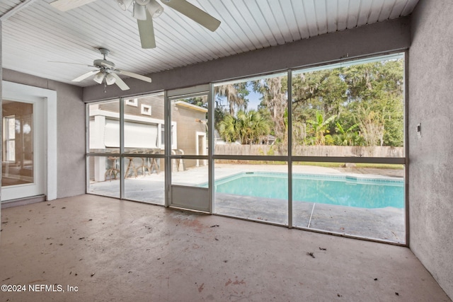 view of swimming pool featuring ceiling fan