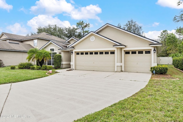 single story home with a front lawn and a garage