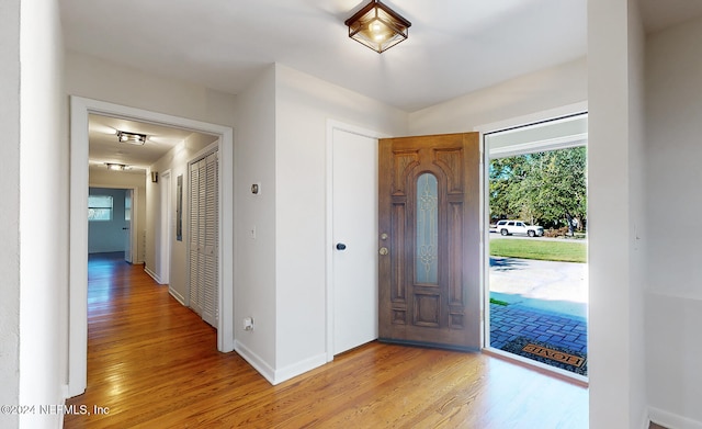 entryway with light hardwood / wood-style floors