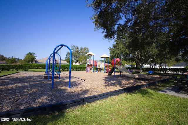 view of jungle gym featuring a yard