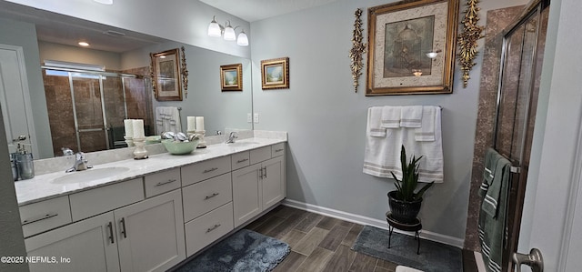 bathroom with vanity, heating unit, and walk in shower