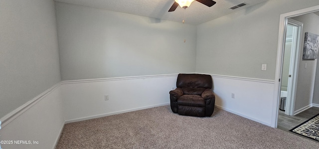 unfurnished room with light carpet, a textured ceiling, and ceiling fan