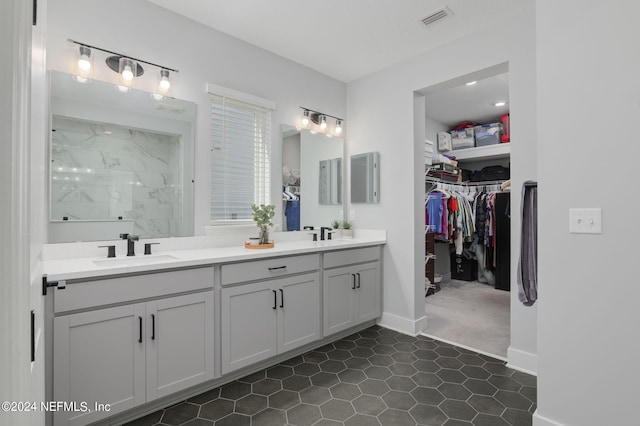 bathroom featuring vanity and tile patterned flooring