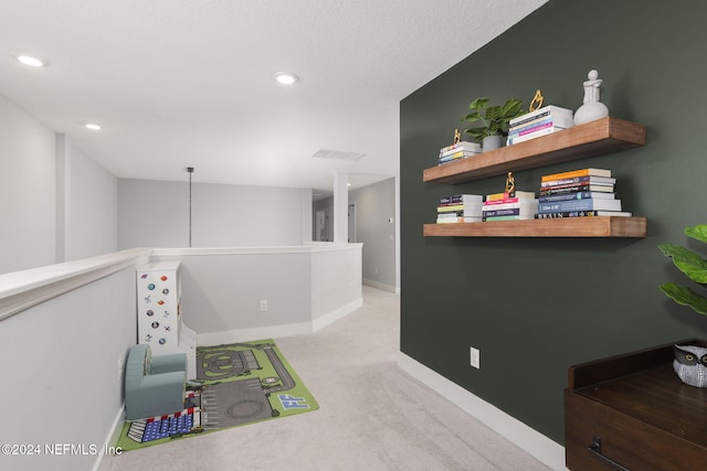 game room with light colored carpet