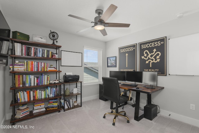 home office featuring light colored carpet and ceiling fan