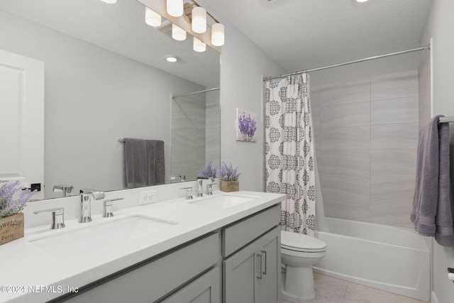 full bathroom featuring vanity, a textured ceiling, toilet, and shower / bathtub combination with curtain