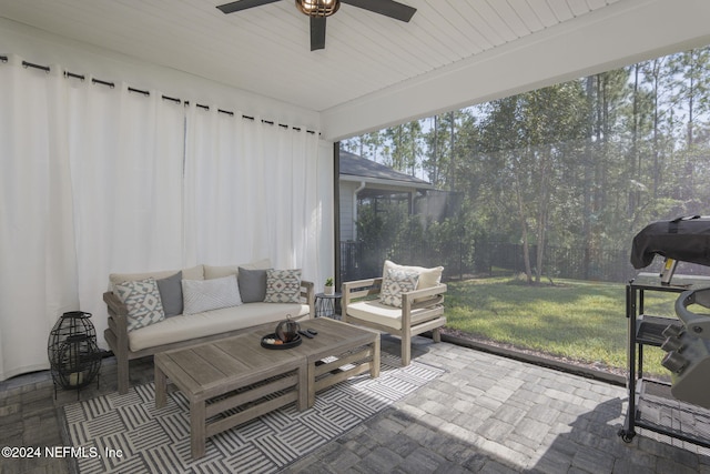 sunroom / solarium with ceiling fan