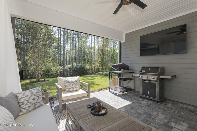 sunroom / solarium featuring wooden ceiling and ceiling fan