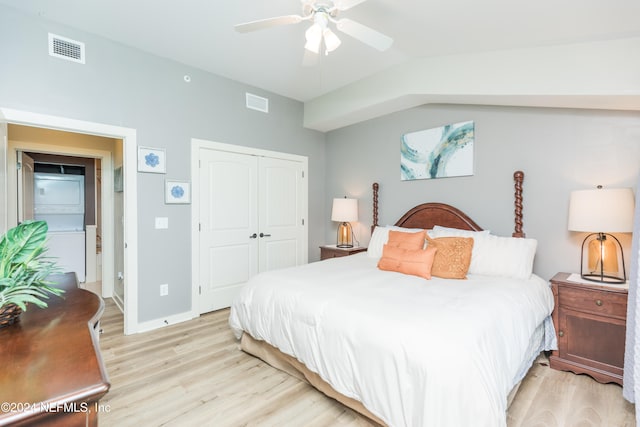 bedroom featuring light hardwood / wood-style flooring, a closet, vaulted ceiling, and ceiling fan