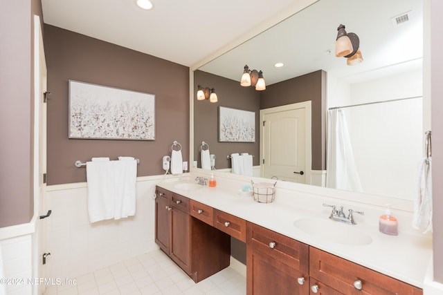 bathroom with vanity, tile patterned floors, and walk in shower