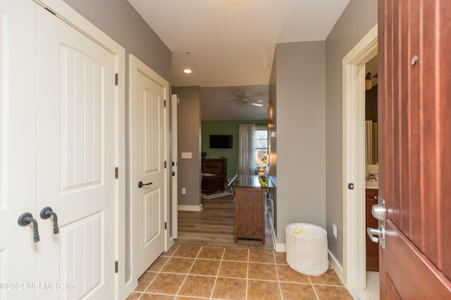 hallway featuring tile patterned floors