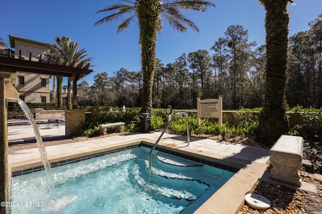 view of pool featuring an in ground hot tub and a patio area