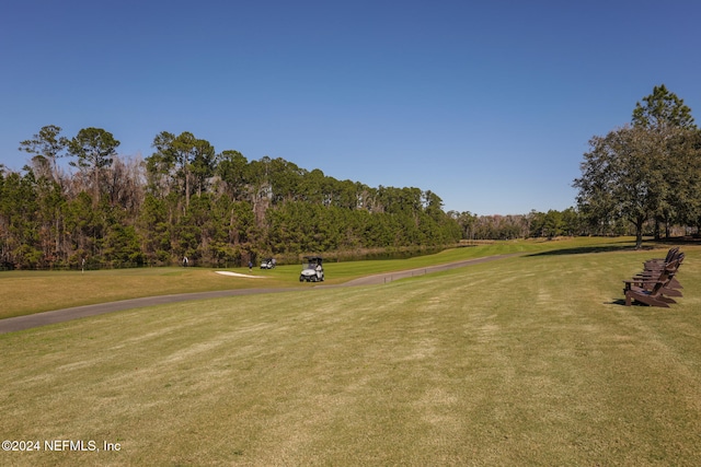 surrounding community with a lawn